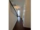 Interior hallway with dark hardwood floors and modern staircase at 2018 Packing District Way, Orlando, FL 32804