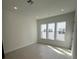 Spacious living area with tile floor and multiple windows at 2018 Packing District Way, Orlando, FL 32804