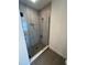 Modern shower with frameless glass enclosure and gray tile at 2018 Packing District Way, Orlando, FL 32804