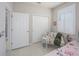 Comfortable bedroom featuring a window with plantation shutters and access to an ensuite bathroom at 745 Asturias Rd, Davenport, FL 33837