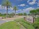 Entrance to the Montecito clubhouse with mature landscaping and trees at 745 Asturias Rd, Davenport, FL 33837