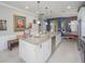 Bright kitchen features a large island with granite countertops and stainless steel appliances at 745 Asturias Rd, Davenport, FL 33837