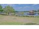 Community lake featuring a dock and a gazebo at 745 Asturias Rd, Davenport, FL 33837