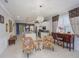 Open concept living area with modern decor, leads to kitchen and dining area at 745 Asturias Rd, Davenport, FL 33837