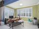 Bright office space with large windows and plantation shutters, offering ample natural light at 745 Asturias Rd, Davenport, FL 33837