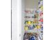 Walk-in pantry equipped with wire shelving, stocked with an abundance of food and household goods at 745 Asturias Rd, Davenport, FL 33837