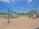 Community playground with various play structures, slides, and climbing areas on a mulch surface at 745 Asturias Rd, Davenport, FL 33837