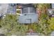 An overhead shot reveals the roof of a home and its proximity to parking and lush trees at 716 Saint Matthew Cir, Altamonte Springs, FL 32714