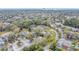 An aerial view showcases the neighborhood with lush trees and well-maintained condos and parking at 716 Saint Matthew Cir, Altamonte Springs, FL 32714