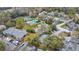 Aerial view of condos reveals community pool, tennis courts, and parking at 716 Saint Matthew Cir, Altamonte Springs, FL 32714