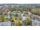 An aerial view of the community showcasing the pool, condos, and lush green trees at 716 Saint Matthew Cir, Altamonte Springs, FL 32714