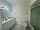 Clean bathroom with vanity, toilet and glass shower at 5156 City St # 118, Orlando, FL 32839