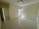 Clean bedroom featuring tiled floors, a ceiling fan and a window at 5156 City St # 118, Orlando, FL 32839