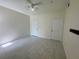 Clean bedroom featuring tiled floors, a ceiling fan and two closets at 5156 City St # 118, Orlando, FL 32839