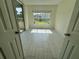 Bonus room with tile floors and screened porch access, offering seamless indoor-outdoor living at 5156 City St # 118, Orlando, FL 32839