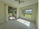 Bonus room with tile floors and screened porch access, offering seamless indoor-outdoor living at 5156 City St # 118, Orlando, FL 32839