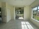Bonus room with tile floors and screened porch access, offering seamless indoor-outdoor living at 5156 City St # 118, Orlando, FL 32839