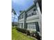 Well-maintained two-story condo with green shutters and lush landscaping at 5156 City St # 118, Orlando, FL 32839