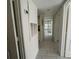 Hallway with tiled floors and bright natural light at 5156 City St # 118, Orlando, FL 32839