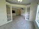 Spacious living room with tiled floors and archways at 5156 City St # 118, Orlando, FL 32839