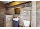 Modern bathroom with wood-like tile and a small vanity at 6031 Ardele Ct, Apopka, FL 32703