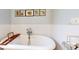 Elegant bathroom with a clawfoot tub and subway tile at 6031 Ardele Ct, Apopka, FL 32703