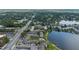 Aerial view features a condo community next to a lake, with mature trees and well-kept roadways at 158 Maitland Ave, Altamonte Springs, FL 32701