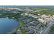 Aerial view of a community with lakeside condos, lush greenery, and convenient parking at 158 Maitland Ave, Altamonte Springs, FL 32701