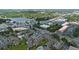 Expansive aerial view showcasing the neighborhood's pool, lush landscaping, and proximity to the lake and commercial district at 158 Maitland Ave, Altamonte Springs, FL 32701