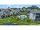 Aerial shot of community townhomes featuring a pristine pool and recreational area by the lakefront at 158 Maitland Ave, Altamonte Springs, FL 32701