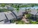 Aerial view showcases property nestled near a serene lake, with lush tropical landscaping at 158 Maitland Ave, Altamonte Springs, FL 32701