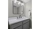 Updated bathroom with a gray vanity, quartz countertop, matte black faucet, and square mirror at 158 Maitland Ave, Altamonte Springs, FL 32701