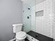 Stylish bathroom with a tiled shower featuring black fixtures and glass door at 158 Maitland Ave, Altamonte Springs, FL 32701