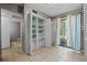 Bright bedroom featuring tile floors, built-in shelving, and a large window with natural light at 158 Maitland Ave, Altamonte Springs, FL 32701