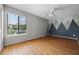 Bedroom featuring laminate floors, ceiling fan and a mountain mural at 158 Maitland Ave, Altamonte Springs, FL 32701