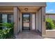 Townhouse entryway showcasing a brick-paved area, complemented by lush greenery and a clear view into the home at 158 Maitland Ave, Altamonte Springs, FL 32701