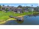 Lakefront townhome exteriors with a pier on the water, showcasing the community's scenic beauty at 158 Maitland Ave, Altamonte Springs, FL 32701