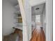 Hallway featuring laminate floors, a carpeted stairs and a shelving closet at 158 Maitland Ave, Altamonte Springs, FL 32701