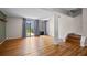 Bright living room featuring wood floors and sliding glass doors leading to the patio at 158 Maitland Ave, Altamonte Springs, FL 32701