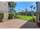 Cozy brick patio adjacent to a well-maintained lawn with mature trees and landscaping at 158 Maitland Ave, Altamonte Springs, FL 32701