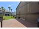 Private brick patio offers a relaxing outdoor space next to the lush green common area at 158 Maitland Ave, Altamonte Springs, FL 32701