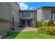 Private patio area with sliding glass doors, surrounded by lush landscaping at 158 Maitland Ave, Altamonte Springs, FL 32701
