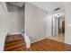 Carpeted staircase off of living room with hardwood style floors throughout entry at 158 Maitland Ave, Altamonte Springs, FL 32701