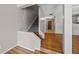 Carpeted staircase off of living room with hardwood style floors throughout entry at 158 Maitland Ave, Altamonte Springs, FL 32701