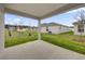 Spacious backyard showing green lawn and young trees at 8377 Wilder Pines Ave, Lakeland, FL 33809