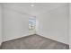 Clean bedroom featuring neutral carpet, a window, and painted walls at 8377 Wilder Pines Ave, Lakeland, FL 33809