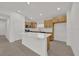 Modern kitchen with white countertops, island, and stainless steel appliances at 8377 Wilder Pines Ave, Lakeland, FL 33809