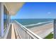Enjoy breathtaking beach and ocean views from this condo balcony with white railings at 2545 S Atlantic Ave # 2107-2108, Daytona Beach Shores, FL 32118