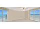 Serene bedroom showcasing balcony access with ocean views and neutral decor at 2545 S Atlantic Ave # 2107-2108, Daytona Beach Shores, FL 32118