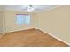 Simple bedroom featuring hardwood floors and a ceiling fan at 2545 S Atlantic Ave # 2107-2108, Daytona Beach Shores, FL 32118